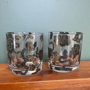 West Elm set of 2 tumbler glasses, w/ black/gold rose and snake designs
